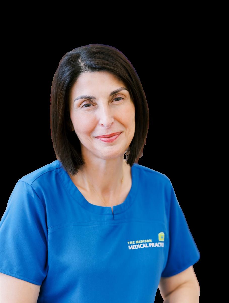 Professional female healthcare practitioner in blue Madison Medical Practice uniform